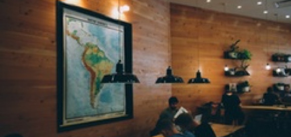 students studying near map on wall