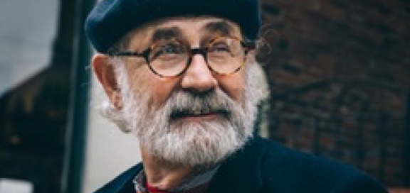 man with grey beard and glasses